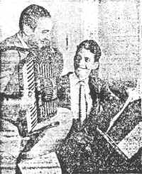 George Hoven (left) and Chester Shull work out on a new melody. Their song, "Sin," is one of the favorites on the hit parade.