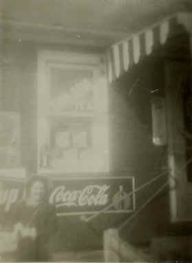  This photo shows my sister Peggy in front of the original store. 