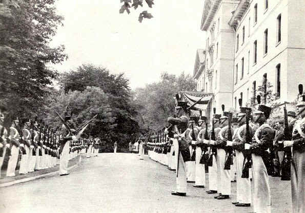The cadet corps forms a guard of honor in front of Old Main just before the Academic Procession starts. - Photo from The Delaware County Advocate, June 1942